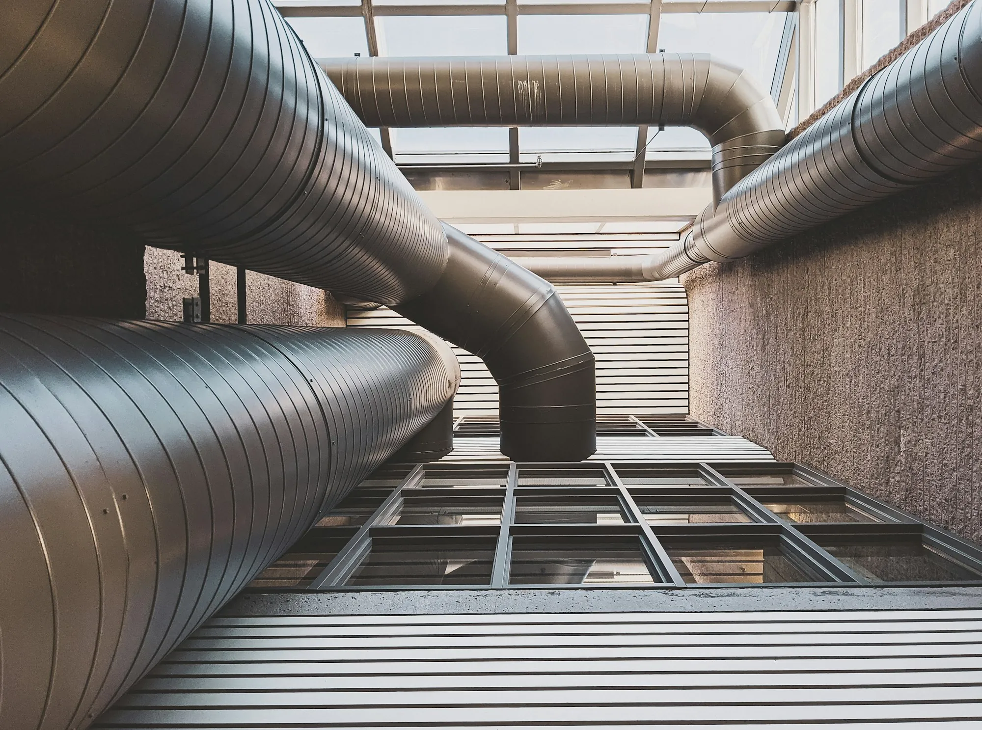 Large metal ductwork running along a building